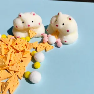 Cute hamster squishy toy with soft flocked texture and decorative cheese accessories