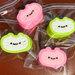Detailed view of cute cat-shaped squishy stress relief toys in individual packaging