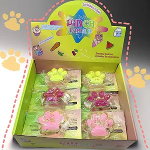 Detailed macro view of cute cat paw squishy stress relief toys in a Pinch Family display box.