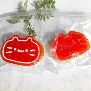 Close-up of red cat squishy toys in clear plastic packaging
