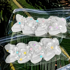 Detailed view of white butterfly-shaped squishy stress relief toys in packaging