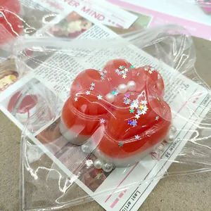 Detail view of cat paw silicone squishy toy with glitter stars and pearls decoration