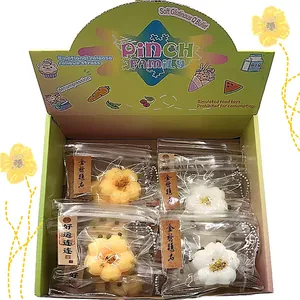 Detailed view of Osmanthus cake stress relief toys in individual transparent bags