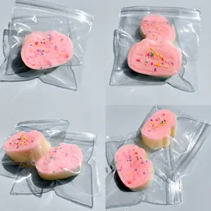 Detailed view of pink cat-shaped slow rebound squeeze toys with colorful sprinkles in bags