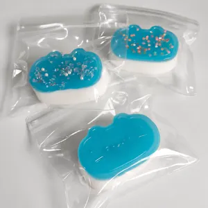 Detailed view of blue and white cat-shaped squishy stress relief toys in packaging