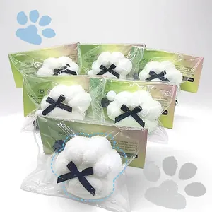 Detailed macro view of packaged sun-activated white cat paw stress relief squeeze toys