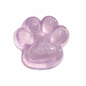 Cute purple glitter cat paw squishy toy with translucent soft jelly texture and sparkles