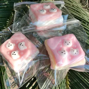 Detailed view of adorable Westie puppy toast squishy stress relief toys in packaging