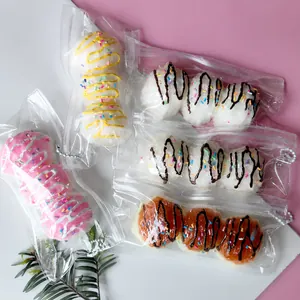 Detailed view of triple Takoyaki squishy stress relief toys in clear packaging bags