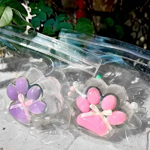 Pink and purple cat paw squishies in pearlescent transparent soft glue