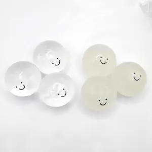 Close-up detail of transparent and color-changing squishy balls with happy smiley faces