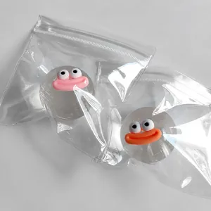 Detailed macro shot of a transparent crystal ball squeeze toy with a cute cartoon face