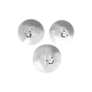Set of three pearlescent slow rebound squishy stress relief balls with smiley faces