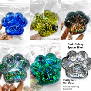 Galaxy themed cat paw squeeze toy in various glitter colors for stress relief
