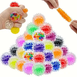 Detailed view of colorful spiky stress balls being squeezed and stretched for relief