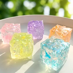 Detailed view of colorful translucent aurora cheese squishy toys in five vibrant colors