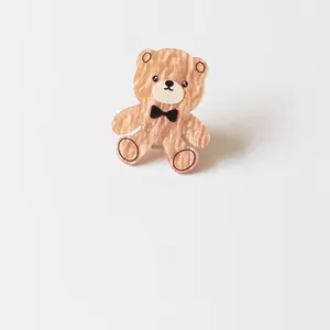 Cute acrylic teddy bear hair clip with elegant champagne gold wavy pattern texture