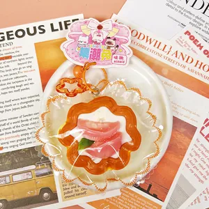 Close-up of a peach tart squishy toy in clear packaging with a cute rabbit card