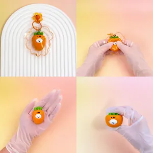 Detailed macro view of a handmade silicone carrot squishy toy being squeezed for stress relief