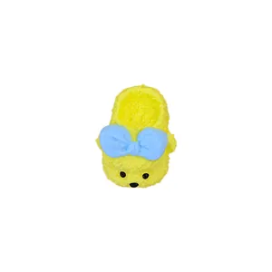 Handmade yellow fluffy slipper squeeze toy with a blue bow for stress relief and decor