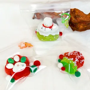 Detailed view of Christmas themed silicone food squishy toys in clear zip bags with charms