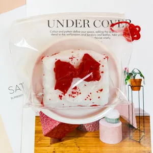 Close-up of food-grade silicone cream cake squishy toy in clear zipper bag