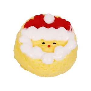 Detailed view of a Santa Claus themed yellow silicone squishy toy with cream topping.
