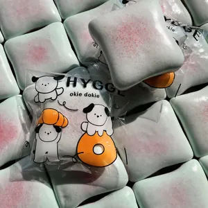 Macro detail of slow-rebound squishy toast toy with cute dog packaging and dimensions.