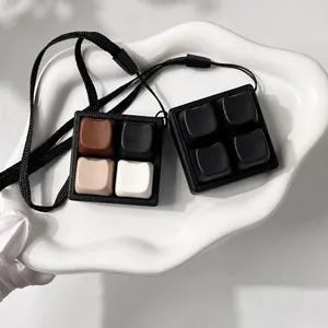 Detailed view of two 4-key mechanical switch tester fidget pendants in different colors