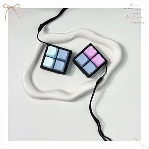 Detailed top view of 4-key macro pad fidget toy keychain with colorful pastel keycaps