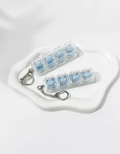 Detail view of 4-key mechanical switch fidget keychains in standard and cat-ear styles