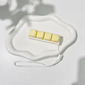 Close-up of a 4-key mechanical keyboard fidget toy keychain on a white tray