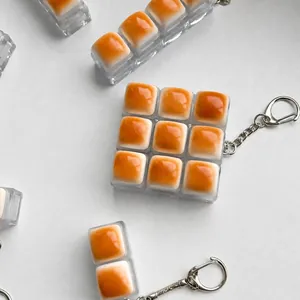 Llavero de juguete antiestrés con diseño de pan de caramelo y teclas táctiles