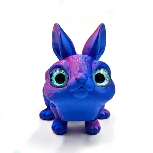 Macro view of a 3D printed rabbit figurine featuring iridescent blue and purple finish