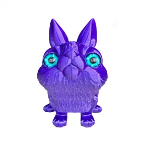 Articulated 3D printed purple rabbit toy with vibrant cyan eyes for desk decor
