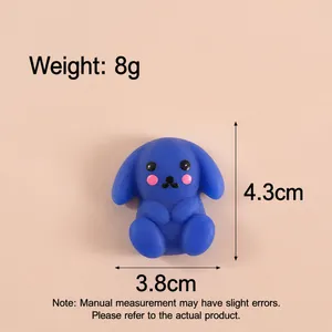 Vue détaillée d'un jouet à presser lapin bleu avec mesures de taille et de poids.