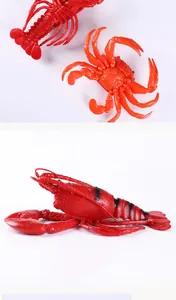 Detailed side and top views of realistic red rubber lobster and crab toys for beach play