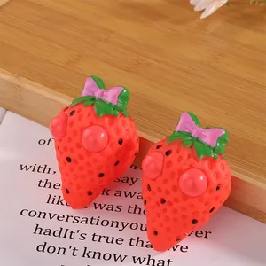 Cute strawberry eye-popping squishy toy for stress relief and fun sensory play for kids