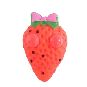 Cute strawberry squeeze toy with pop-out eyes for stress relief and sensory fun play