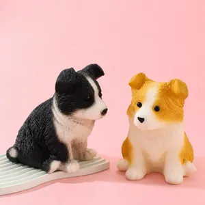 Detailed view of two cute squishy Border Collie stress relief toys on a pink background