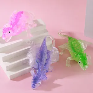 Close-up detail showing translucent colorful dragon squishy stress toys on white steps
