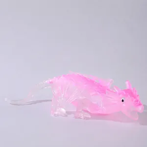 Detailed side view of a translucent pink and white dragon squeeze toy for stress relief