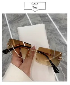 Detailed view of fashionable Gold Tea rimless square sunglasses with tea gradient lenses