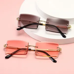 Rimless square gradient sunglasses with elegant gold metal temples in pink and brown.