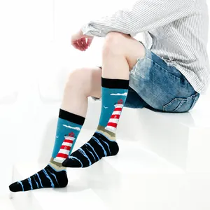 Trendy mid-calf socks featuring a colorful lighthouse pattern on a vibrant blue background