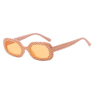 Retro oval sunglasses featuring orange lenses and a stylish orange chevron pattern frame