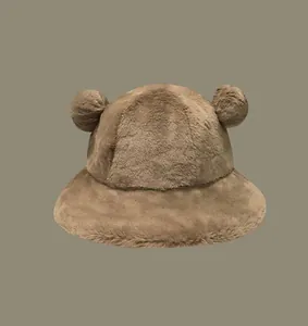 Adorable brown fuzzy bucket hat with plush bear ears for winter warmth and cozy style.