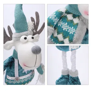 Detailed macro view of teal Christmas reindeer plush showing knitted texture and telescopic legs