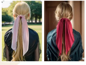 Professional close-up of long satin hair scarf ribbons in pink and red on ponytails