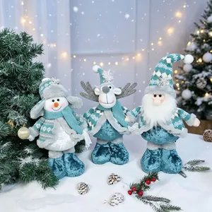 A set of three adorable plush Christmas figurines featuring a snowman, reindeer, and Santa gnome.